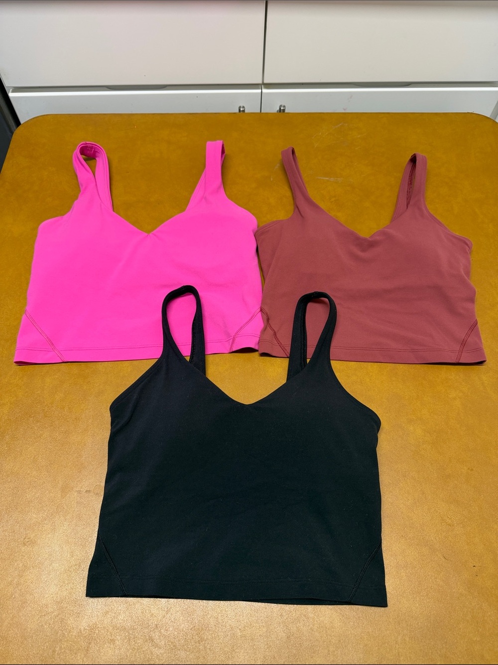lululemon athletica Cropped V-Neck Tanks — Hot Pink, Rust, Black . Bundle